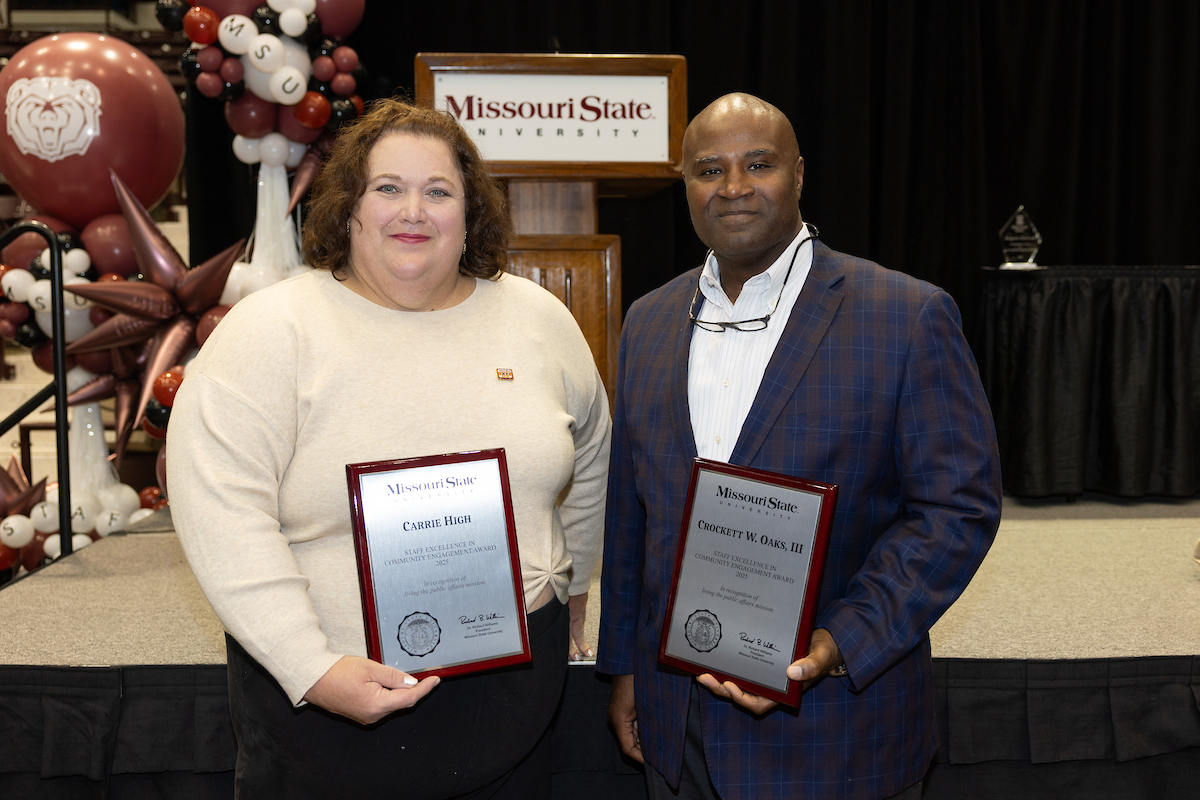 2 staff winners with plaques