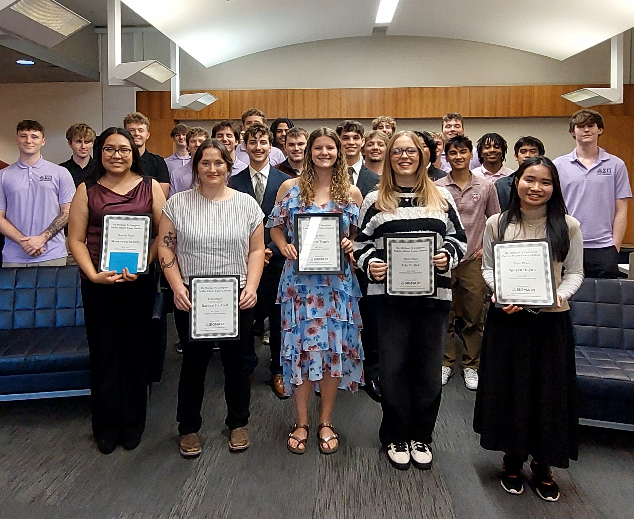 group of Sigma Pi members and essay winners