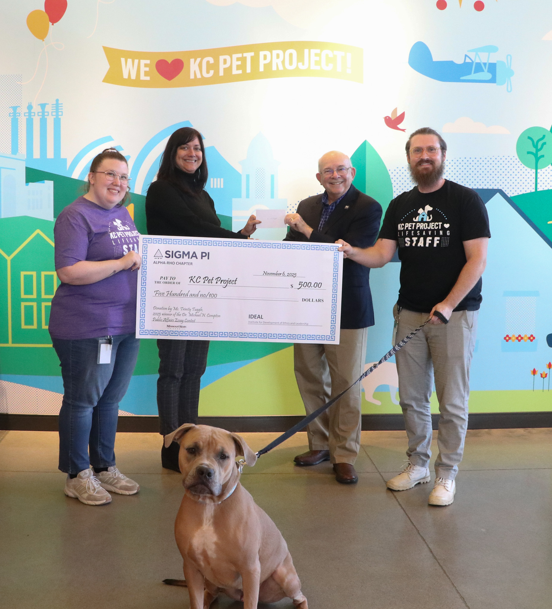 KC Pet Project staff with check