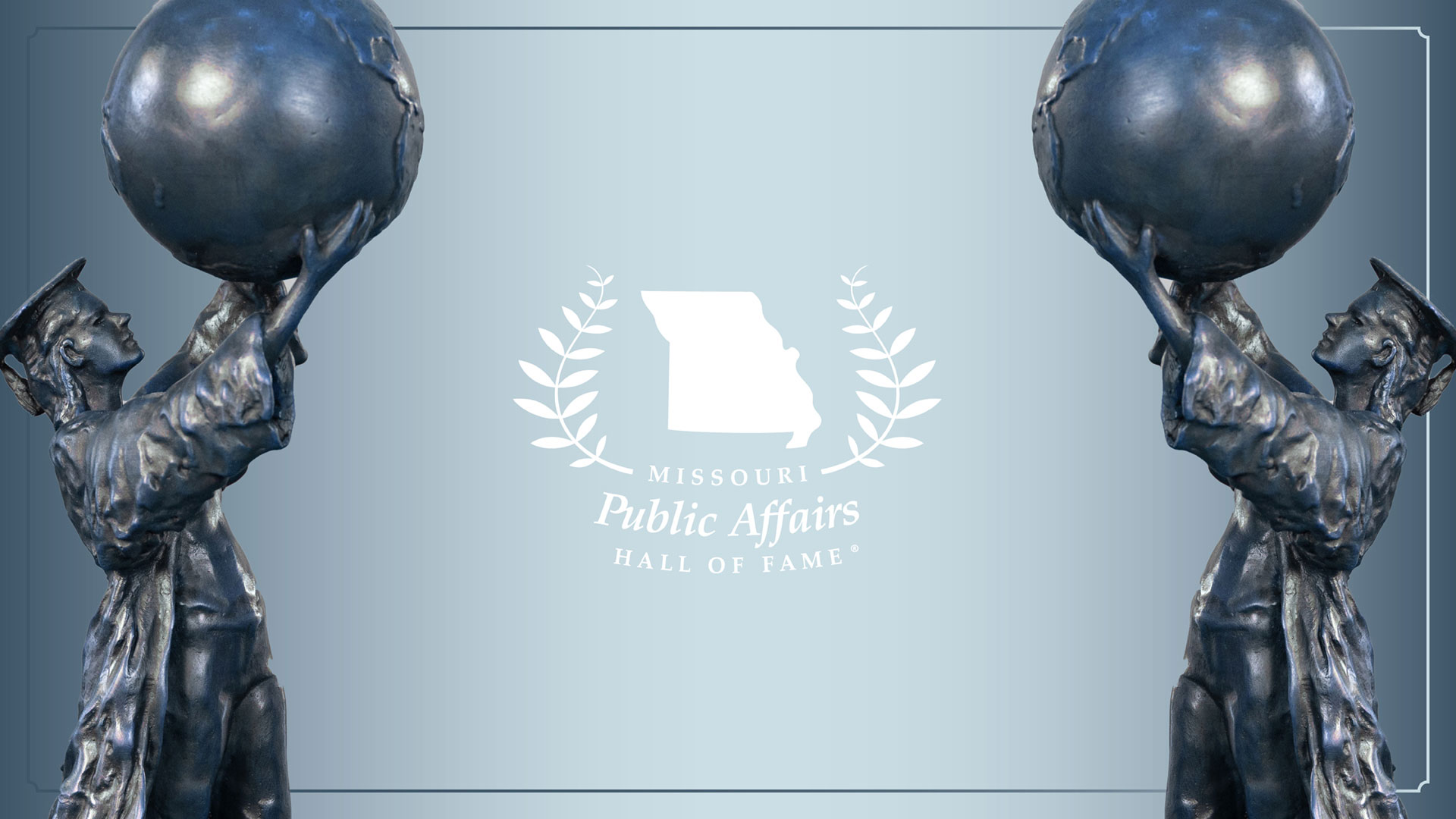 The Missouri Public Affairs Hall of Fame logo centered between two Citizen Scholar statues facing each other.