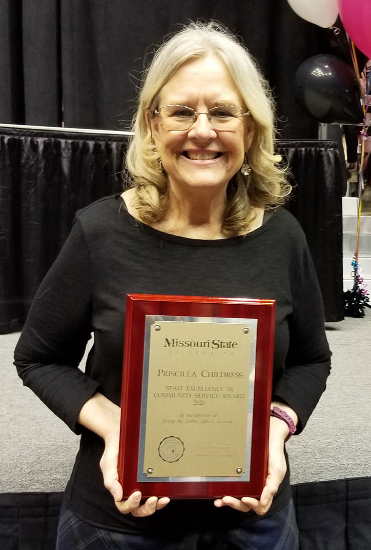 picture of Priscilla Childress with plaque